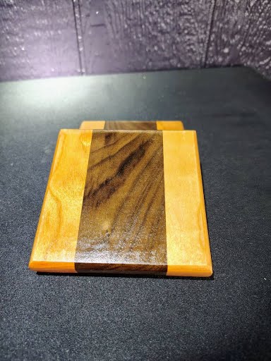 Single walnut and cherry coaster top view showing grain pattern