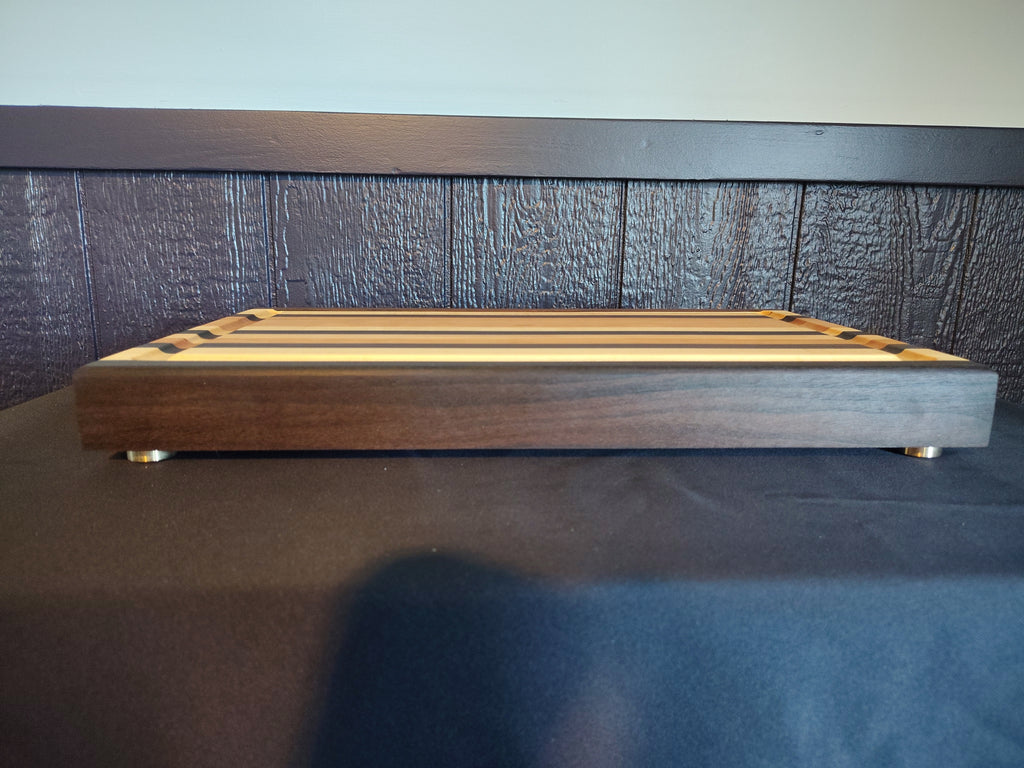 Handcrafted maple and walnut cutting board - bottom with rubber feet
