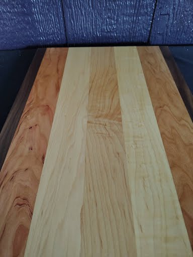 Cutting board with tape measure showing 21 inch length