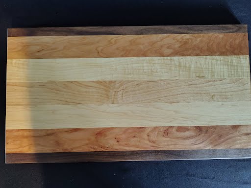Cutting board with tape measure - side angle view