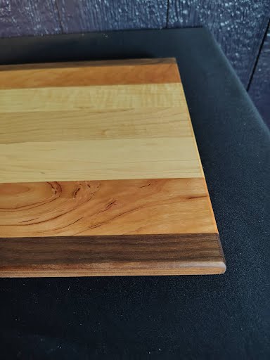 Corner detail of cutting board showing chamfered edge and wood grain